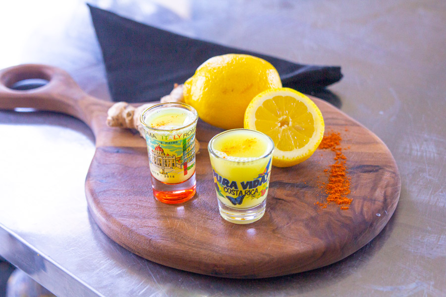 Ginger-Lemon Wellness Shots with Cayenne Pepper on the kitchen table.